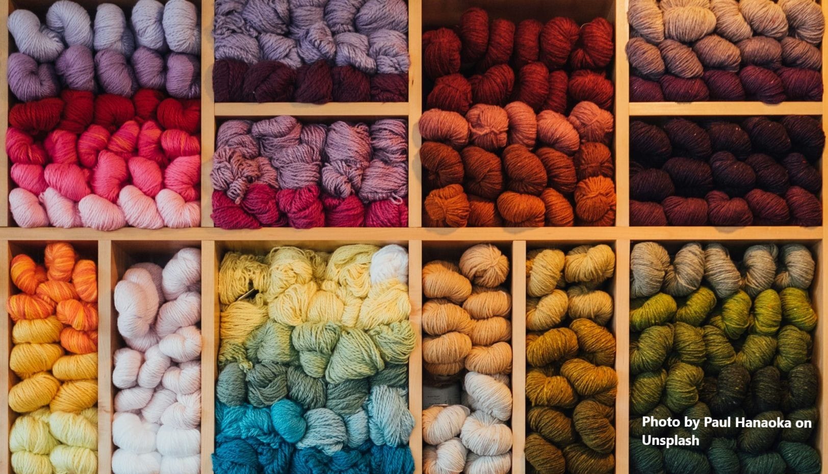 Shelves displaying balls of coloured wool to be used for crocheting to improve my brain health